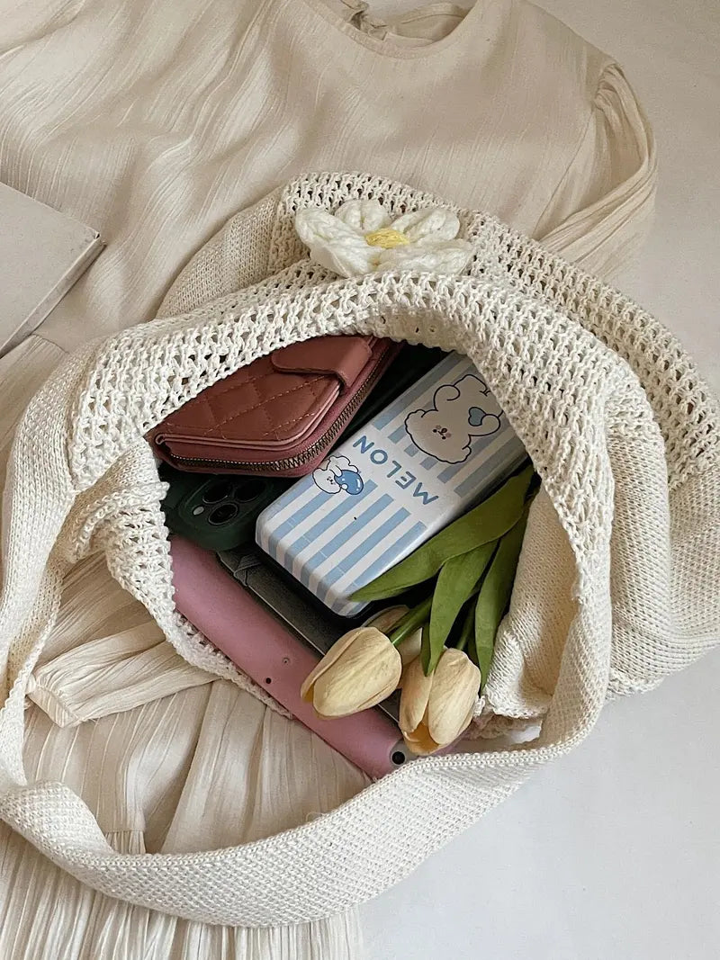 Women's solid-color straw bag with floral accents
