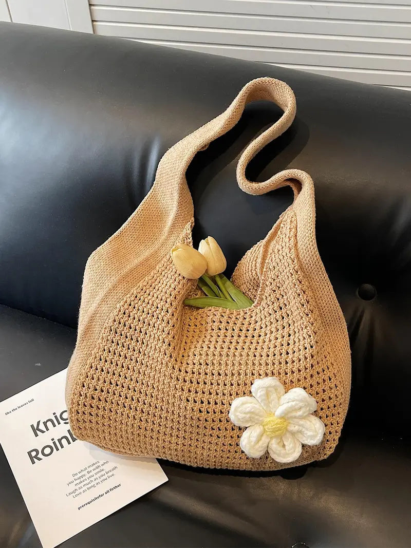 Women's solid-color straw bag with floral accents