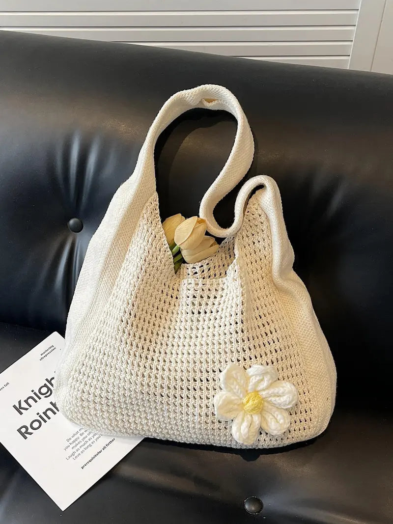 Women's solid-color straw bag with floral accents