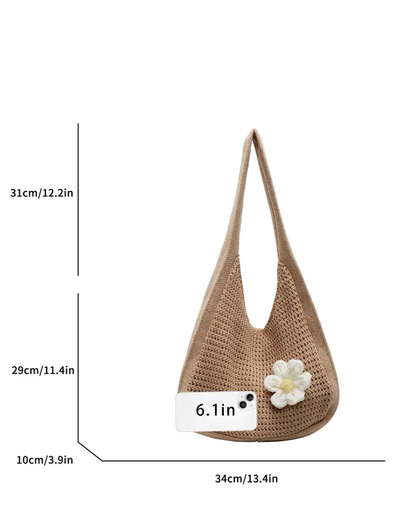 Women's solid-color straw bag with floral accents
