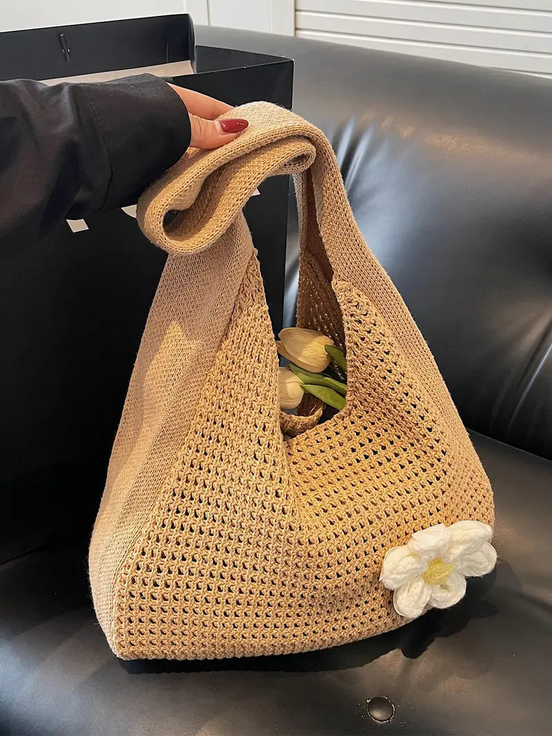 Women's solid-color straw bag with floral accents